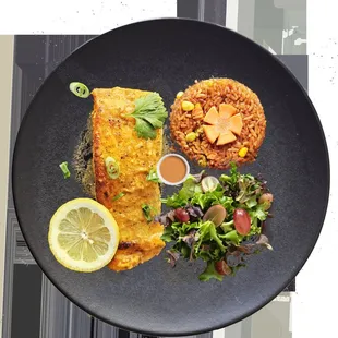 Baked Salmon with Jollof rice, salad and masarap sauce (Signature sauce)