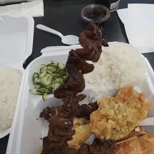Teriyaki beef on a stick veggie tempura  cucumber salad and steamed rice