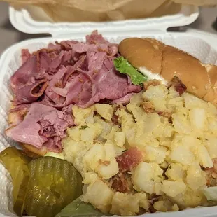 Corned beef sandwich with hot potato salad
