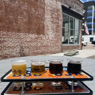 Flight of their Hazy, West Coast, Pecan Brown Ale and Dark IPA