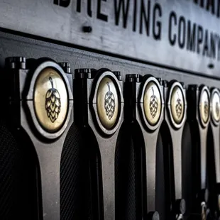 a row of beer taps