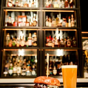 a plate of food and a glass of beer