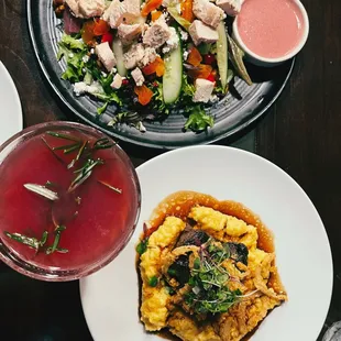 two plates of food and a drink