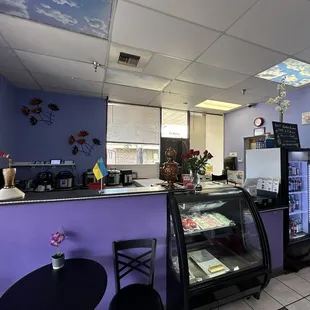 Ordering area for to go orders, cold beverage case and bakery display case.