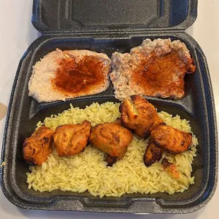 Chicken kabob rice Pilaf, hummus top left and baba ghanoush top right