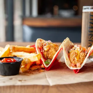 a plate of food and a glass of beer