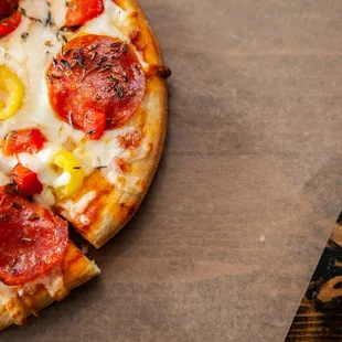 a pepperoni and corn pizza