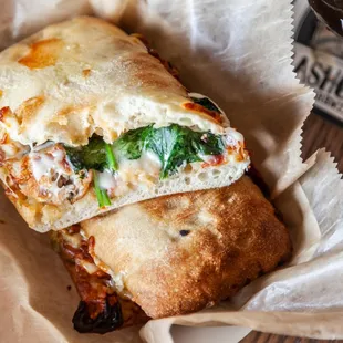 a sandwich with cheese and spinach