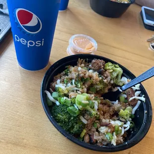 a bowl of rice and broccoli