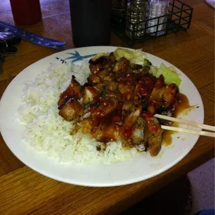 Teriyaki chicken with some chili sauce on it