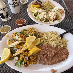 #5 Street Tacos shrimp tacos freshly cooked. Added cilantro, onions & corn. Comes with pinto or black beans. I choose the refried style.