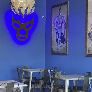 a restaurant with a blue wall