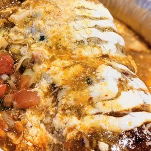 a close up of a baked enchilada