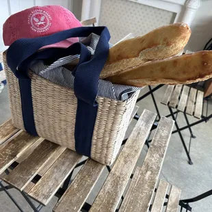 a basket of bread and a hat