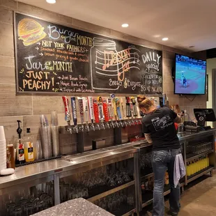Daily specials board, beer on tap &amp; one of the awesome bartenders!