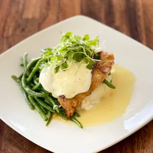 Chicken Saltimbocca with crispy prosciutto, sage, fresh mozzarella; served with garlic mashed potatoes, seasoned veggies, lemon beurre blanc