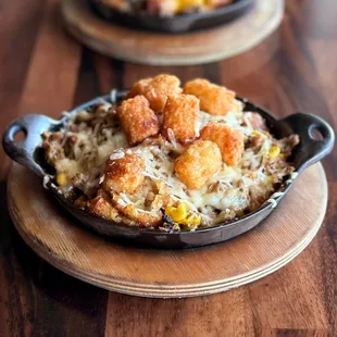 MODERN (vegan) TATER TOT HOTDISH: seasoned Beyond Meat, corn, house-made dairy-free cream of mushroom, tater tots, plant-based mozzarella.