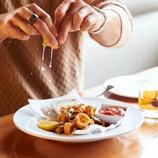 Calamari, served with lemon-dill aioli and MJK red sauce.