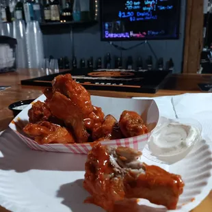 a plate of chicken wings