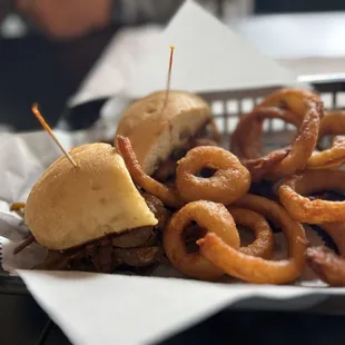 Philly cheesesteak and onion rings - house made roast beef with hand dipped onion rings, yum!