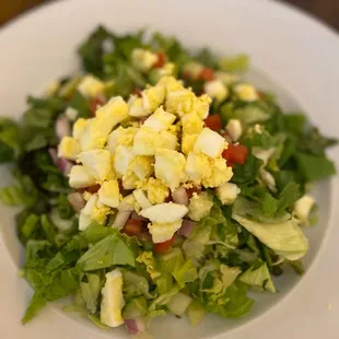 a salad with eggs and lettuce