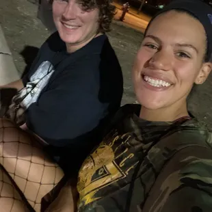 two women sitting on a bench