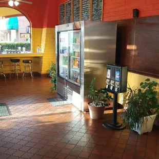 Order at the counter left of the drinks and dessert fridge