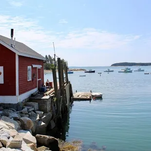 a red house on the shore