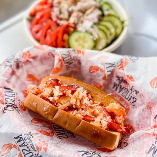 a lobster roll and a salad