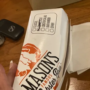 a hand holding a box