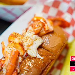 a lobster roll and a pickle