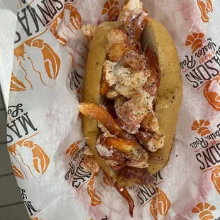 Classic lobster roll with crispy bacon