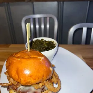 a burger with onion rings