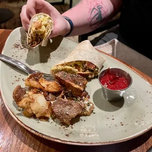 Breakfast burrito and crispy breakfast potatoes