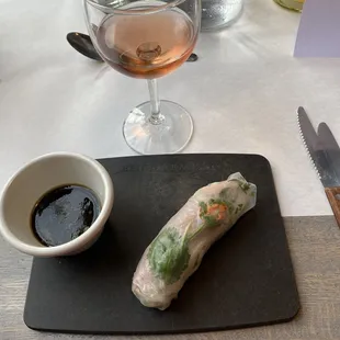 Smoked Duck Spring Roll with delicate carrot and cilantro flower design.