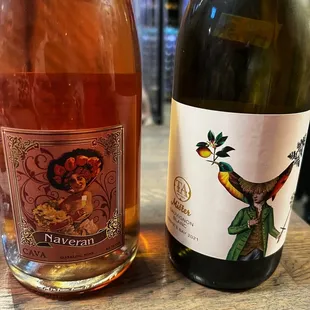 two bottles of wine on a table