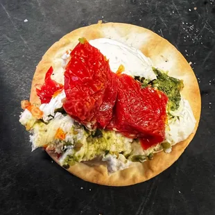 a flatbread pizza with tomatoes and cheese