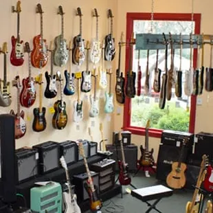 The electric room features new, used and vintage guitars, basses and amps