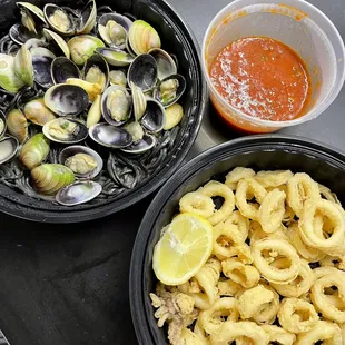 two bowls of clams and a bowl of sauce