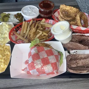 1/2 of Brisket, cheese burger, fries, onion rings, mac and cheese, potato salad! Ala carte style.