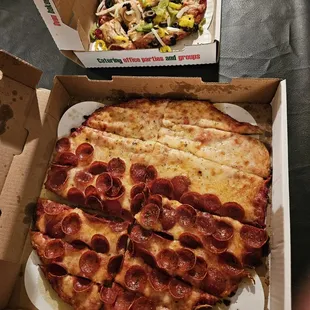 two boxes of pepperoni pizza