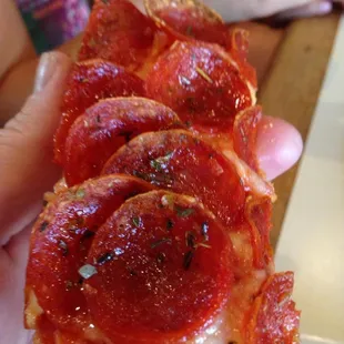 a slice of pepperoni pizza