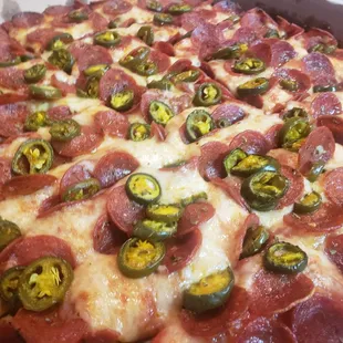 a pepperoni and jalapeno pizza