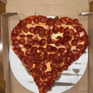 a heart shaped pepperoni pizza