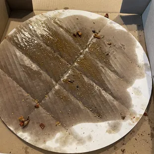 Grease on cardboard because of excessive wait time in the store.