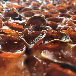 a closeup of a pepperoni pizza