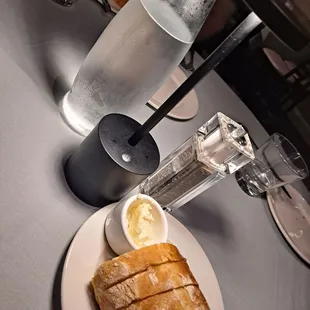 a plate of bread and a glass of water