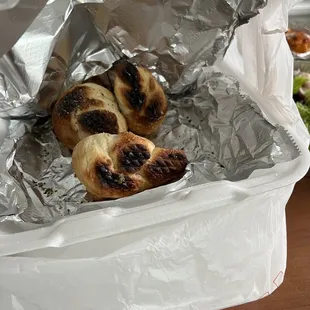 a hot dog wrapped in tin foil