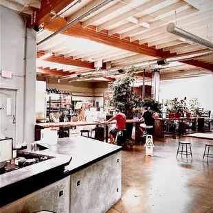 a coffee shop with a counter and stools