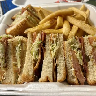 food is so delicious check out this club sandwich w/fries :)